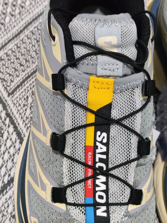 Salomon XT-6 series outdoor sports shoes in beige and navy blue color scheme